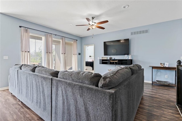 21904 Crystal Ave, Peculiar, MO 64078 - living area featuring dark wood finished floors and ceiling fan