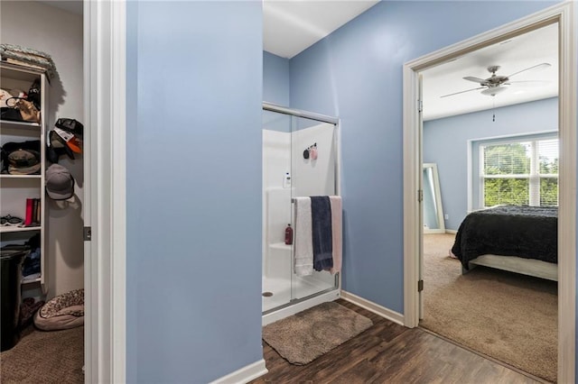 21904 Crystal Ave, Peculiar, MO 64078 - full bath with a shower stall, ensuite bathroom, wood finished floors, a ceiling fan, and a spacious closet