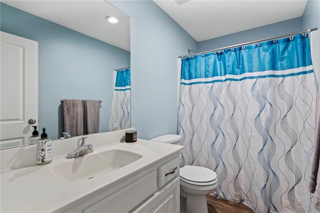 21904 Crystal Ave, Peculiar, MO 64078 - bathroom with vanity, wood finished floors, recessed lighting, and curtained shower