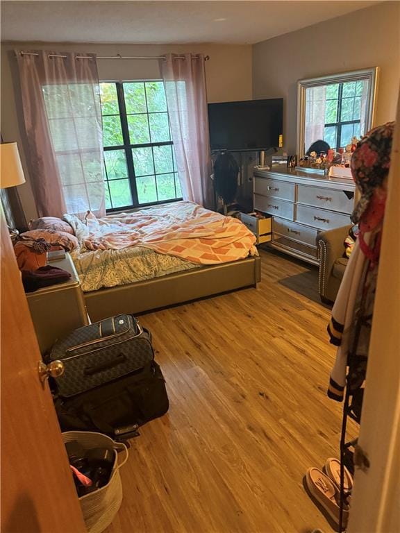 8135 Holmes Rd Unit 202, Kansas City, MO 64131 - bedroom with wood finished floors
