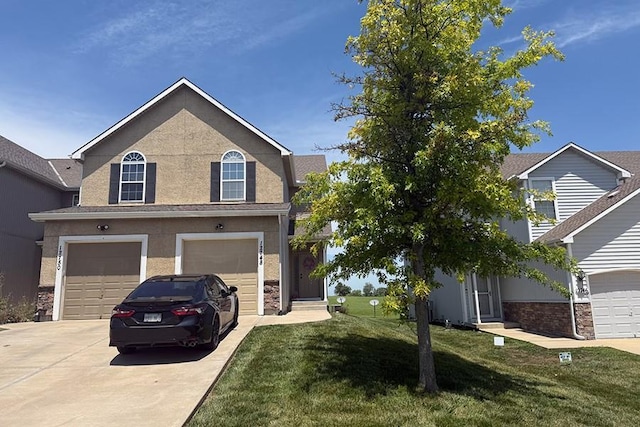 12748 Walker Ave, Kansas City, KS 66109 - traditional-style home with concrete driveway, an attached garage, a front yard, and stucco siding