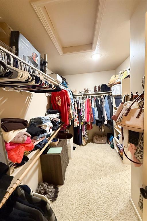 12748 Walker Ave, Kansas City, KS 66109 - spacious closet with attic access, carpet, and a tray ceiling