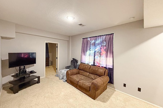 12748 Walker Ave, Kansas City, KS 66109 - carpeted living room featuring a textured ceiling and baseboards