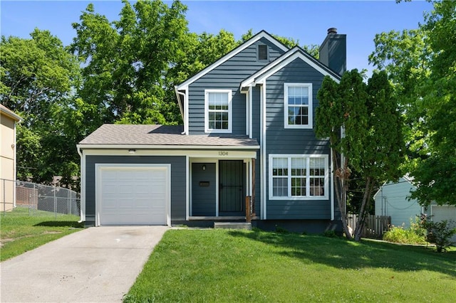 1304 E 41st St, Kansas City, MO 64110 - traditional-style home with an attached garage, concrete driveway, and a chimney