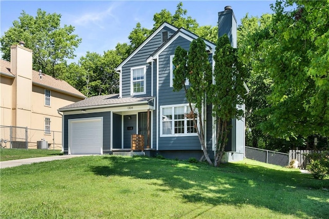 1304 E 41st St, Kansas City, MO 64110 - traditional home featuring an attached garage and driveway