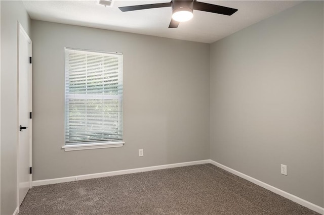 1304 E 41st St, Kansas City, MO 64110 - unfurnished room with a ceiling fan and carpet floors