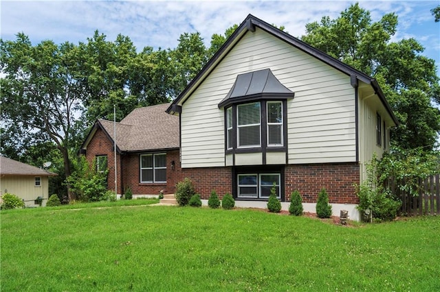 16620 E 36th St, Independence, MO 64055 - split level home featuring brick siding and a front lawn