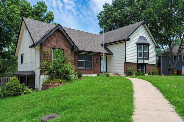16620 E 36th St, Independence, MO 64055 - tri-level home featuring brick siding, a shingled roof, and a front yard
