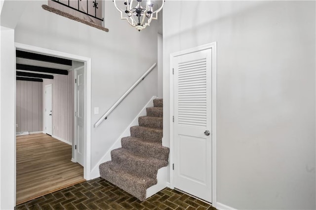 16620 E 36th St, Independence, MO 64055 - stairway with brick patterned floors and a chandelier