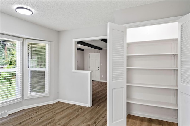 16620 E 36th St, Independence, MO 64055 - unfurnished room with wood finished floors and a textured ceiling