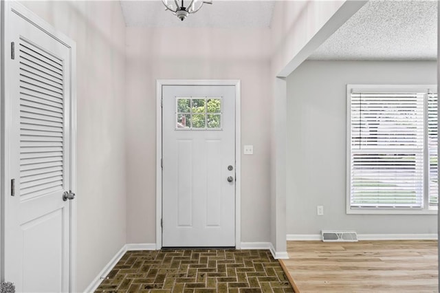 16620 E 36th St, Independence, MO 64055 - foyer featuring baseboards and brick patterned floors