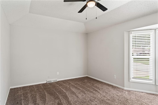 16620 E 36th St, Independence, MO 64055 - unfurnished room featuring plenty of natural light, dark colored carpet, a ceiling fan, vaulted ceiling, and a textured ceiling
