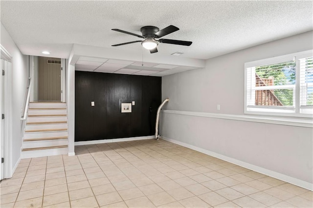 16620 E 36th St, Independence, MO 64055 - empty room with ceiling fan, a textured ceiling, wood walls, and stairway