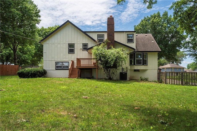 16620 E 36th St, Independence, MO 64055 - back of property featuring stairs, a chimney, a fenced backyard, a deck, and board and batten siding