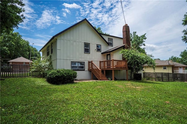 16620 E 36th St, Independence, MO 64055 - rear view of property featuring stairs, a chimney, a fenced backyard, a deck, and board and batten siding