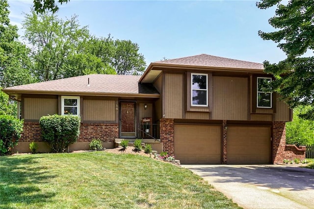 503 SE Brownfield Dr, Lees Summit, MO 64063 - view of front of home featuring brick siding, concrete driveway, an attached garage, and a front yard