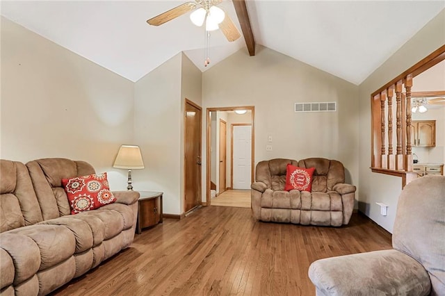 503 SE Brownfield Dr, Lees Summit, MO 64063 - living area featuring ceiling fan, wood finished floors, beamed ceiling, and high vaulted ceiling