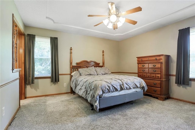 503 SE Brownfield Dr, Lees Summit, MO 64063 - carpeted bedroom with baseboards and a ceiling fan