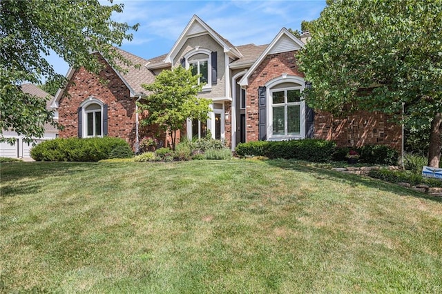 4140 W 131st Ter, Leawood, KS 66209 - view of front facade with a front yard, brick siding, and a chimney