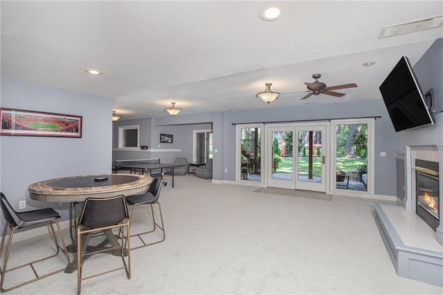 4140 W 131st Ter, Leawood, KS 66209 - dining space featuring a tile fireplace, recessed lighting, ceiling fan, and light carpet