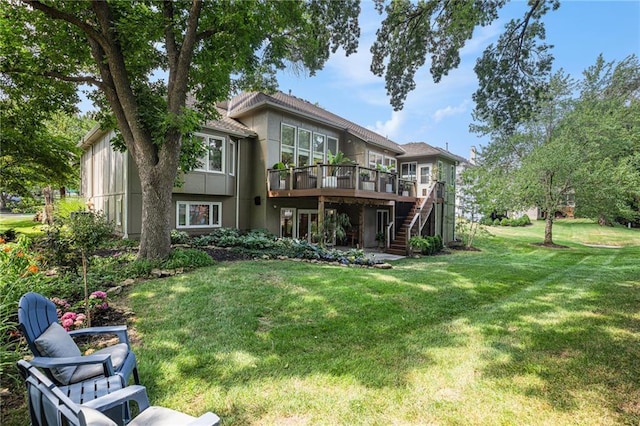 4140 W 131st Ter, Leawood, KS 66209 - rear view of house with a wooden deck, stairway, a lawn, and stucco siding