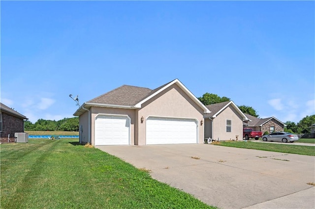 21506 Murlo Cir, Peculiar, MO 64078 - view of front of home with a garage, a front yard, stucco siding, and concrete driveway
