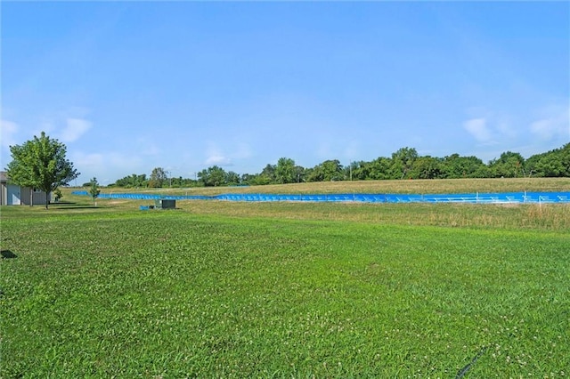 21506 Murlo Cir, Peculiar, MO 64078 - view of green lawn featuring a water view
