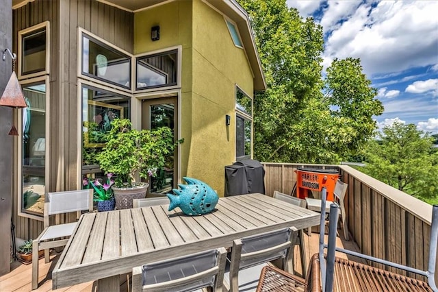 2400 Forest Ave, Kansas City, MO 64108 - wooden terrace with outdoor dining area and area for grilling