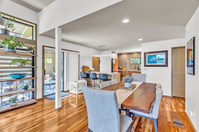 2400 Forest Ave, Kansas City, MO 64108 - dining area featuring light wood finished floors and recessed lighting