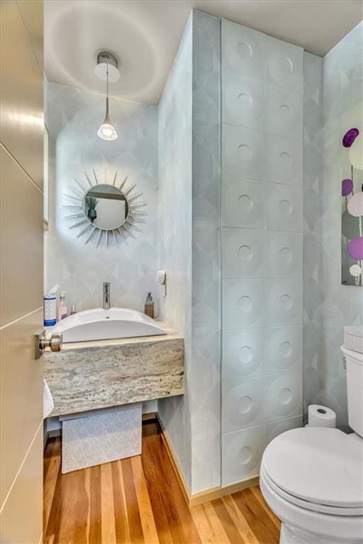 2400 Forest Ave, Kansas City, MO 64108 - bathroom featuring wood finished floors and vanity