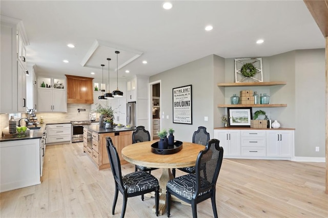 18608 Mohawk Ln, Overland Park, KS 66085 - dining room with light wood-style floors and recessed lighting