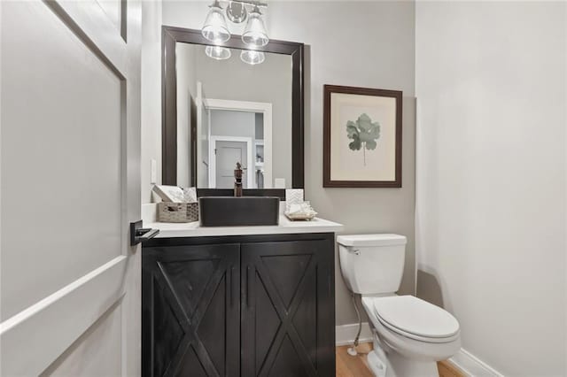 18608 Mohawk Ln, Overland Park, KS 66085 - bathroom with wood finished floors, vanity, and a chandelier