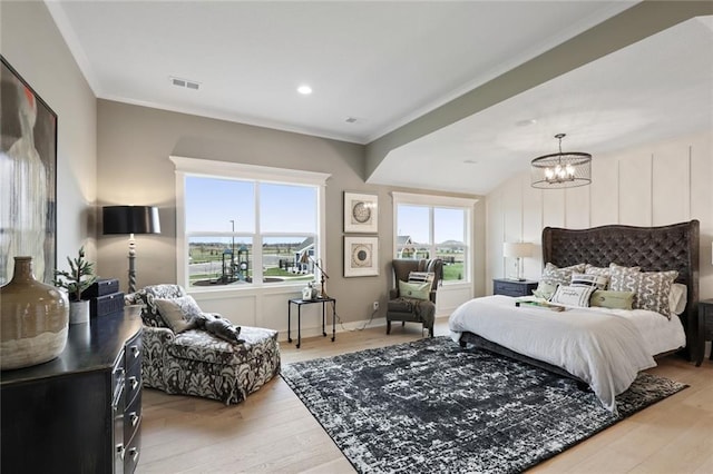 18608 Mohawk Ln, Overland Park, KS 66085 - bedroom with light wood-type flooring, crown molding, and a chandelier