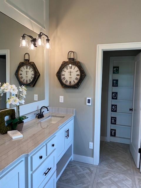 18608 Mohawk Ln, Overland Park, KS 66085 - bathroom featuring vanity and baseboards