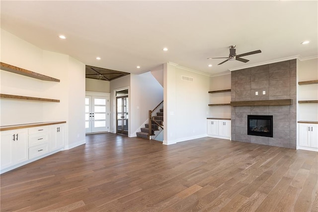 3361 W 187th St, Overland Park, KS 66085 - unfurnished living room with french doors, wood finished floors, recessed lighting, a ceiling fan, and a fireplace