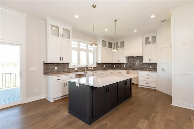 3361 W 187th St, Overland Park, KS 66085 - kitchen featuring white cabinetry, light countertops, tasteful backsplash, and recessed lighting