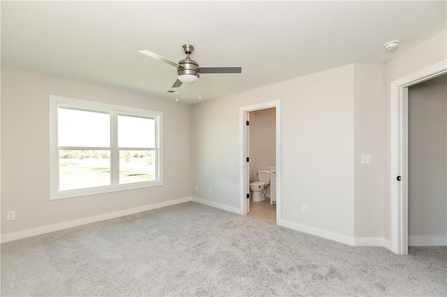 3361 W 187th St, Overland Park, KS 66085 - unfurnished bedroom featuring light colored carpet, ensuite bath, and ceiling fan