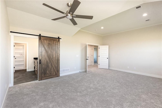 3361 W 187th St, Overland Park, KS 66085 - unfurnished bedroom with carpet floors, ornamental molding, recessed lighting, a barn door, and lofted ceiling