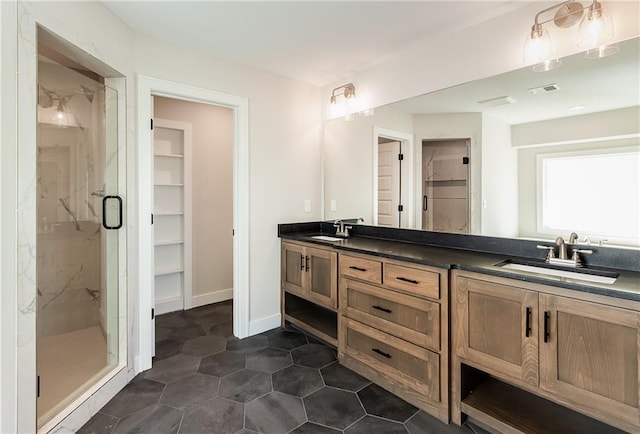 3361 W 187th St, Overland Park, KS 66085 - bathroom featuring a marble finish shower and double vanity