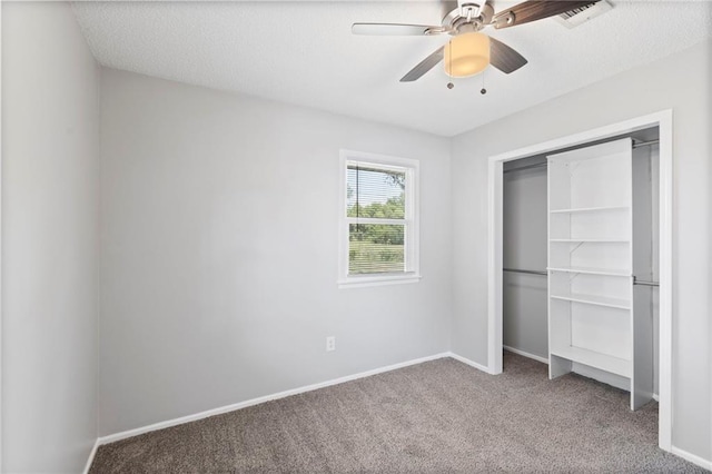 1313 S Clark Ave, Independence, MO 64057 - unfurnished bedroom featuring carpet, a closet, and ceiling fan