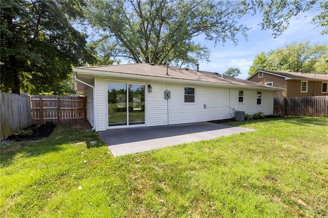 1313 S Clark Ave, Independence, MO 64057 - back of house featuring a patio and a fenced backyard