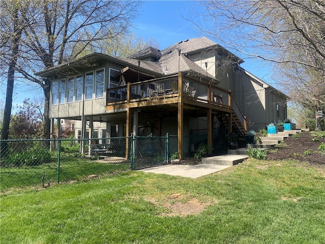 24445 E Truman Rd, Independence, MO 64056 - back of house with stairway, a deck, a gate, and a sunroom
