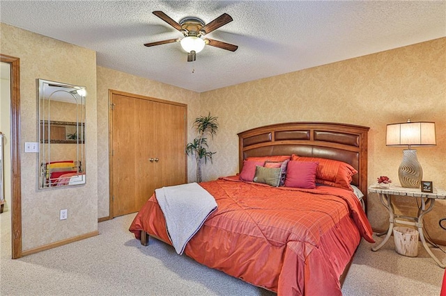 24445 E Truman Rd, Independence, MO 64056 - carpeted bedroom featuring a textured ceiling, a ceiling fan, and a closet