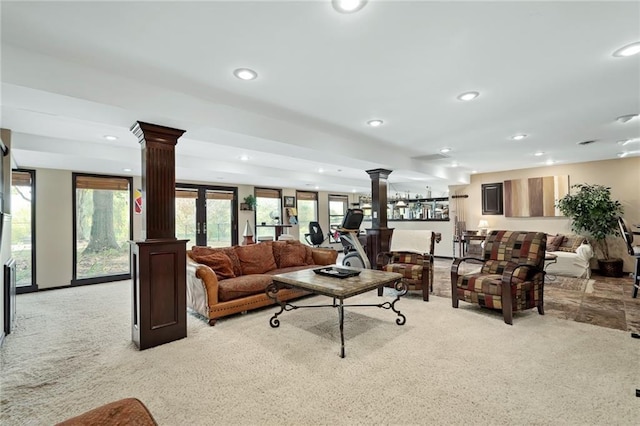 24445 E Truman Rd, Independence, MO 64056 - living area with decorative columns, carpet flooring, recessed lighting, and healthy amount of natural light