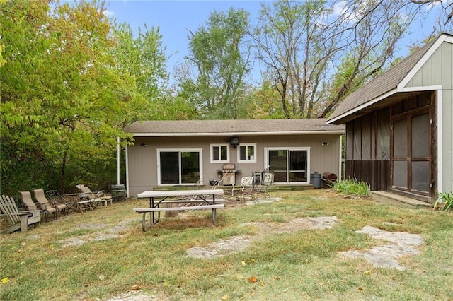 24445 E Truman Rd, Independence, MO 64056 - rear view of house featuring a lawn