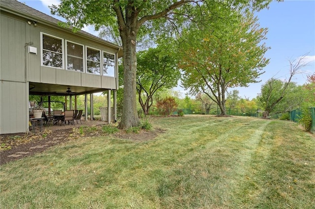 24445 E Truman Rd, Independence, MO 64056 - fenced backyard with ceiling fan and a patio