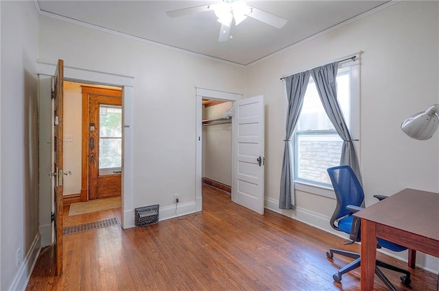 3923 Campbell St, Kansas City, MO 64110 - office with ornamental molding, ceiling fan, plenty of natural light, and wood finished floors