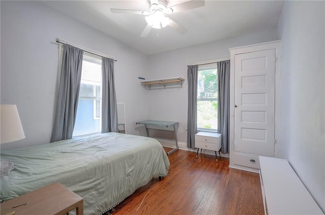 3923 Campbell St, Kansas City, MO 64110 - bedroom with wood finished floors and ceiling fan