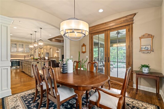 3116 W 137th St, Leawood, KS 66224 - dining area with a chandelier, french doors, light wood finished floors, wine cooler, and recessed lighting