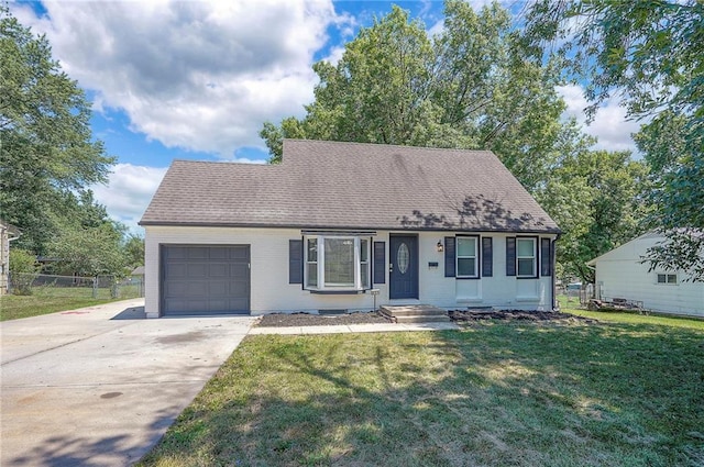 611 Pawnee Ln, Belton, MO 64012 - view of front facade with an attached garage, driveway, brick siding, and roof with shingles